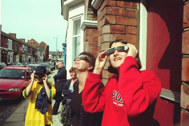 Lorna, Pam and Angela Roscoe get there eclipse shades on to witness the rare phenomenon