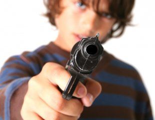 Young boy with gun