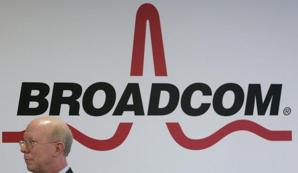 Broadcom Corporation President and Chief Executive Officer Scott McGregor stands in front of the company's logo in Taipei March 18, 2010. REUTERS/Pichi Chuang