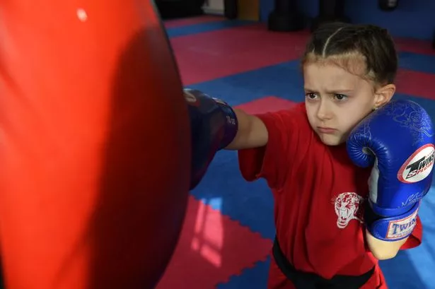 Saran Hill, 7, who has achieved black belt in MMA