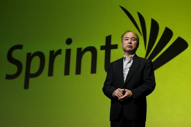 SoftBank Corp. Chief Executive Masayoshi Son speaks as the logo of their U.S. unit Sprint is backgroud in Tokyo May 11, 2015. REUTERS/Issei Kato