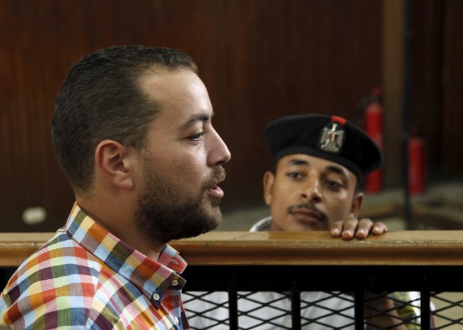 Baher Mohamed, a journalist with Al Jazeera English, in the court room on Saturday in Cairo. Credit Asmaa Waguih/Reuters