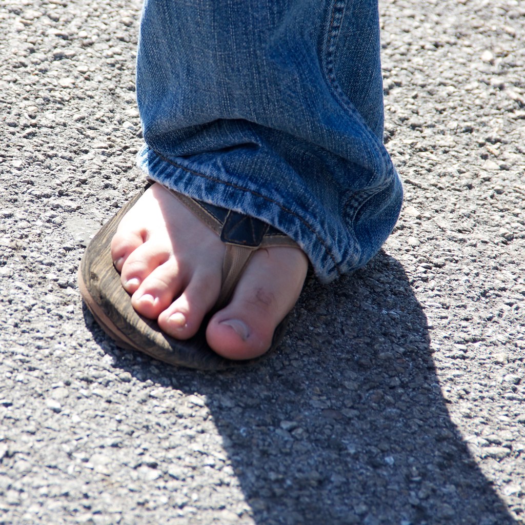 male feet in flip flops
