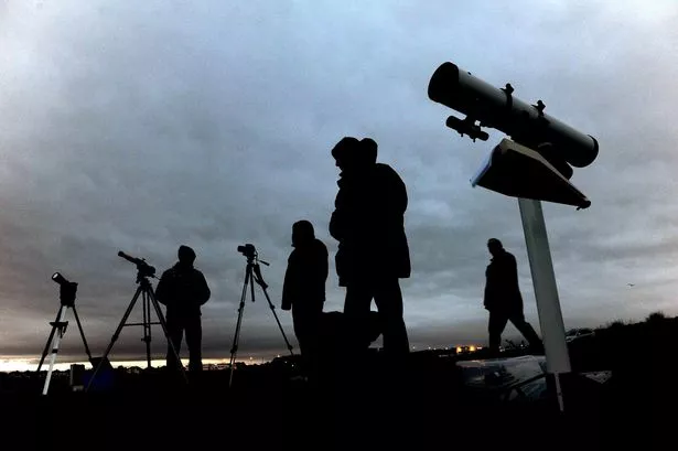 Members of the Newcastle Astronomical Society with telescopes at St. Mary's Lighthouse in Whitley Bay
