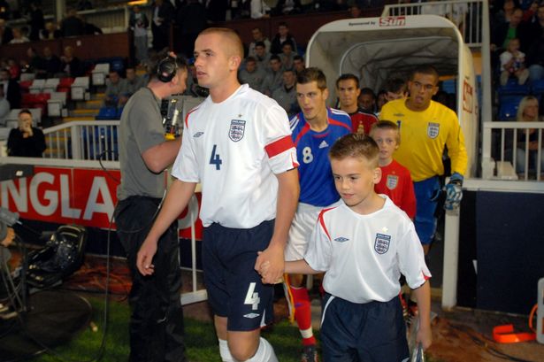 Josh Walker leads his team out in 2006