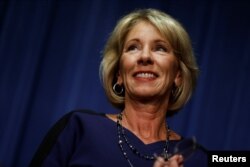 Betsy DeVos addresses Education Department staff on her first day on the job as secretary of education, Feb. 8, 2017.