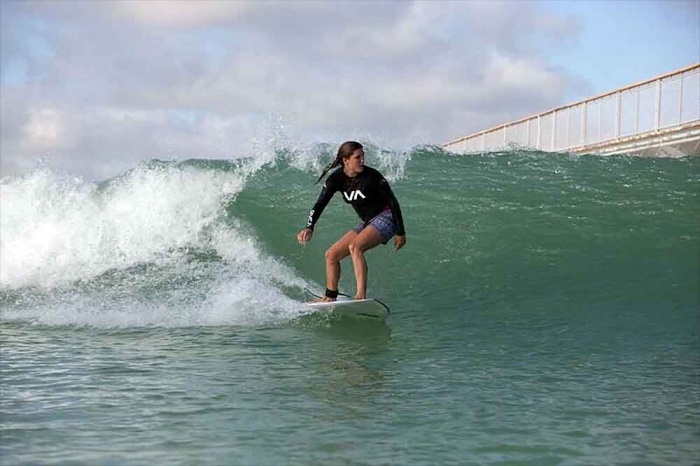 Carving a long-breaking wave, a surfer can stay up for 35 seconds at NLand