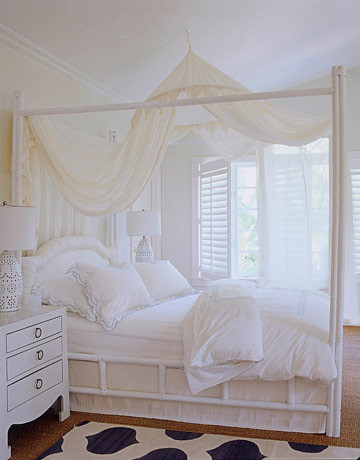 All-white bedroom: Gauzy drapes + bamboo bed + 'Seashell' by Benjamin Moore