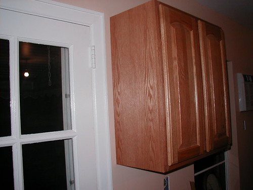 Wall cabinet side panel installation