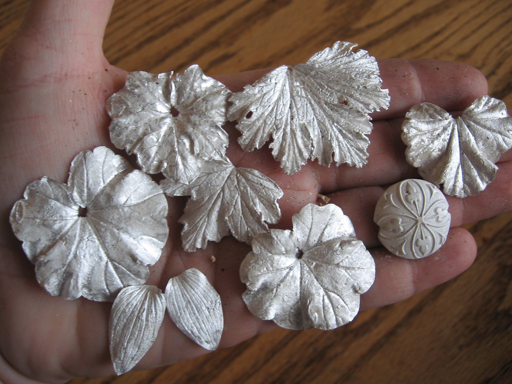 A handful of silver leaves fresh from the kiln