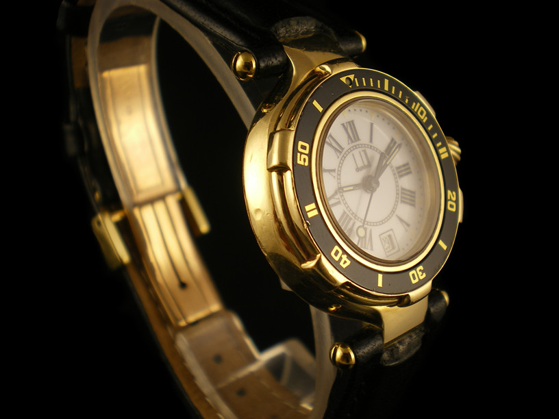Dunhill 18K Gold watch with a white dial