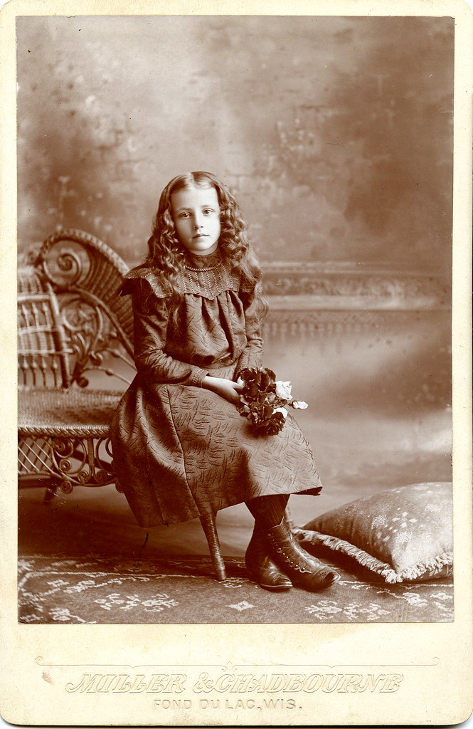 Seated Girl Holding Flowers Cabinet Card