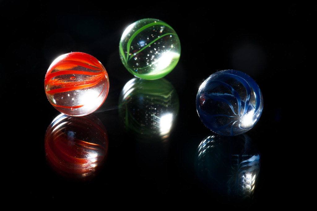 Marbles on shiny surface #3