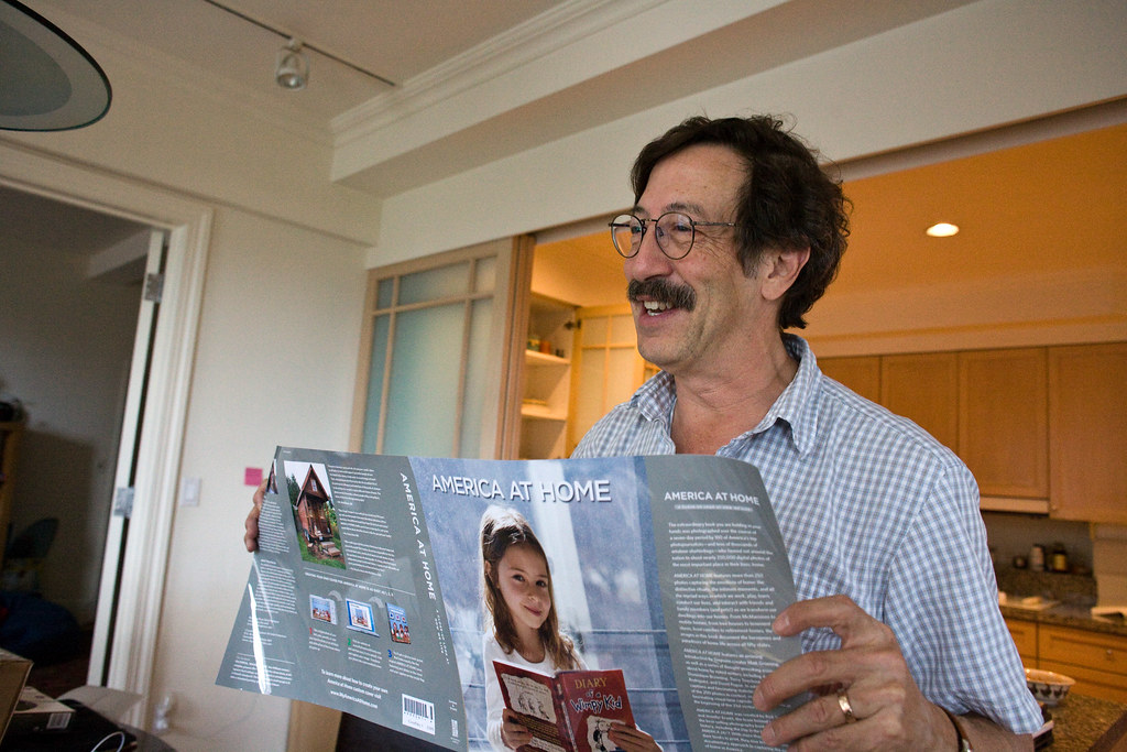 Rick Smolan at Home showing off custom printed book cover
