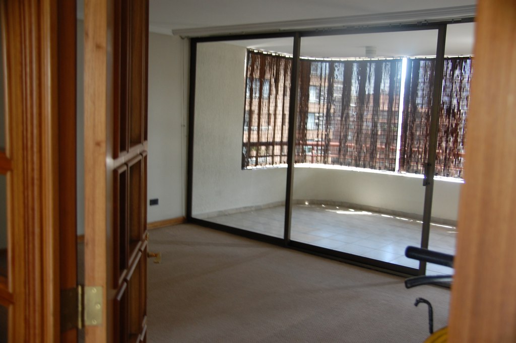 View from French doors to living room and balcony