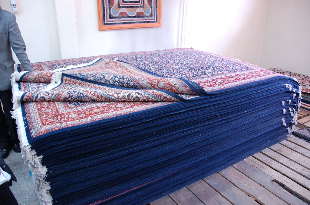 A Pile of Hereke Tree of Life Design Carpets