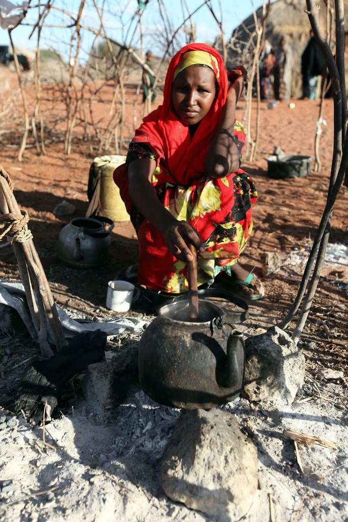 Nouria cooks rice in the kitchen of her home in the village of Abdiaziz, just outside Wajir, Kenya.