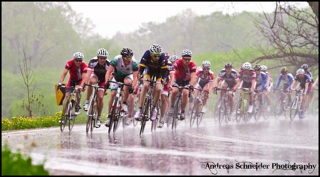 These men fight hard for position in the rain on a slippery down hill curve in  the Elite 3 Men group in the 2011 Nith River Road race, Ontario Cup Road Series #4 May 22, 2011 in Wellesley, Ontario