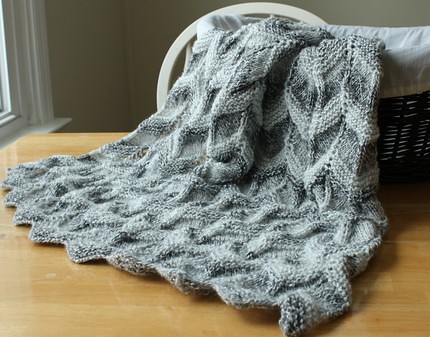 handmade Gray striped baby blanket knit in a ripple pattern