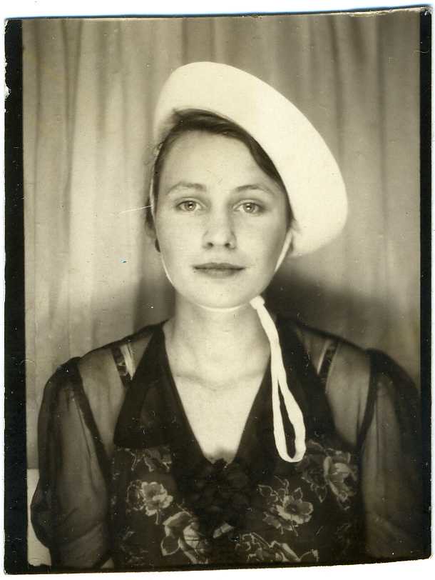 Photobooth: Young Woman Wearing A Hat, With A Look About Her