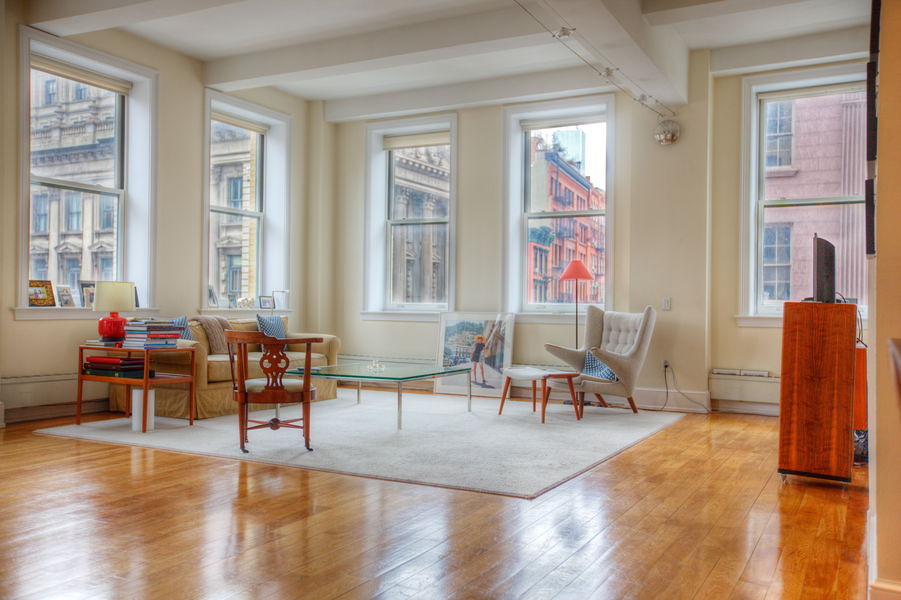 Stunning Soho Loft $10,500 Elegant luxury loft apartment with generous scale for rent in a sought after pre-war Soho condominium with striking landmark views, brilliant light and high end contemporary