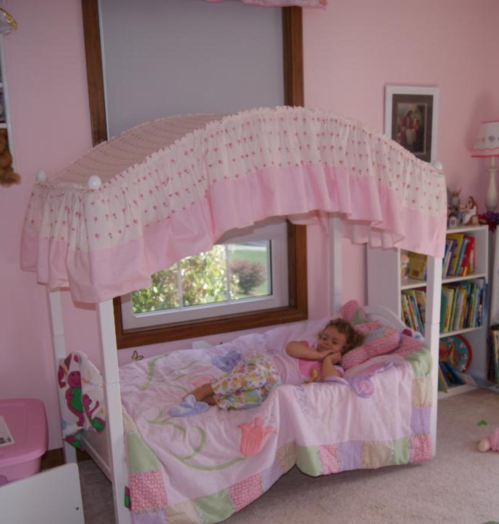 Super cute pink canopy toddler bed