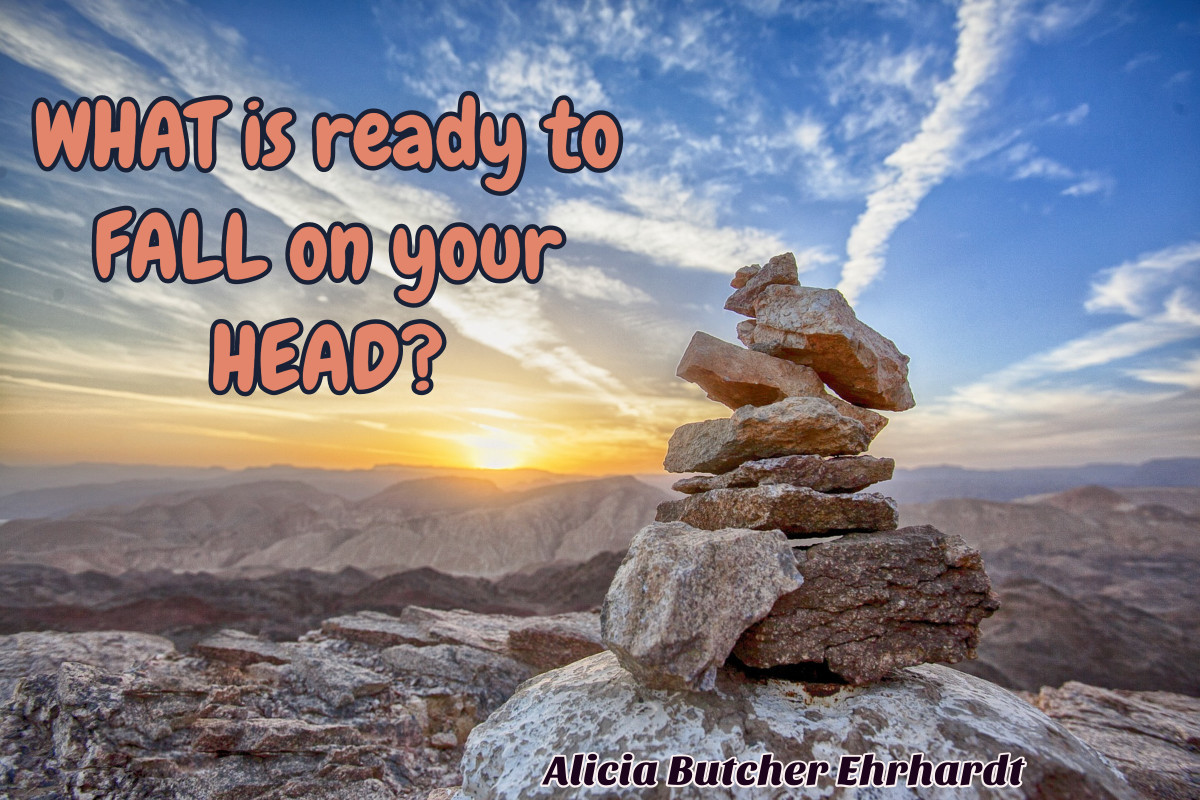Pile of rocks on mountain. Text: What is ready to fall on your head? Alicia Butcher Ehrhardt