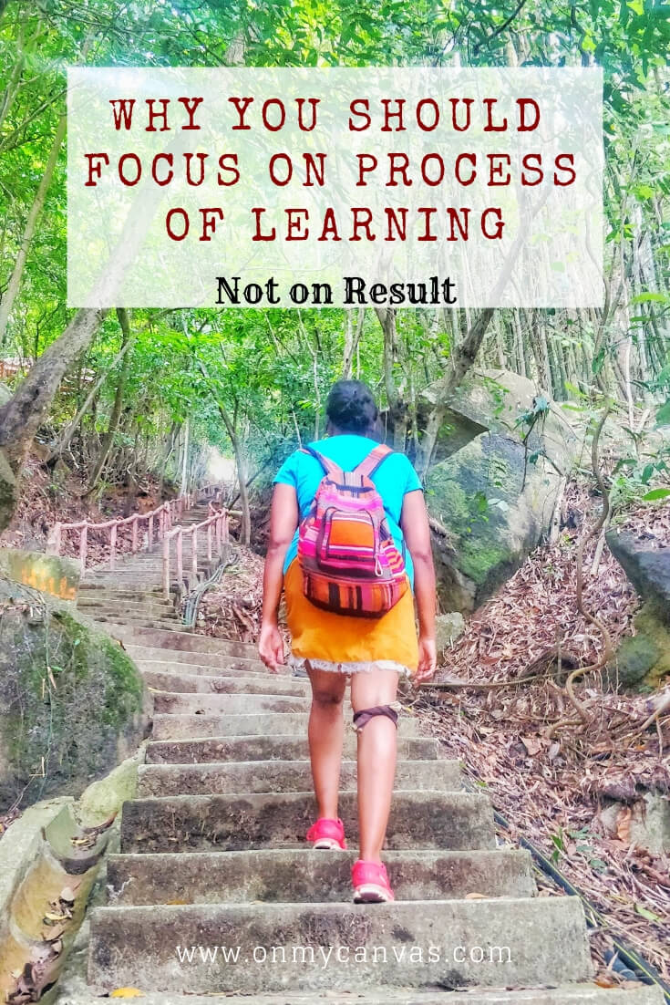 a woman climbing steep stairs of penang hill in malaysia. the image shows how the process of learning or climbing is more important than the result