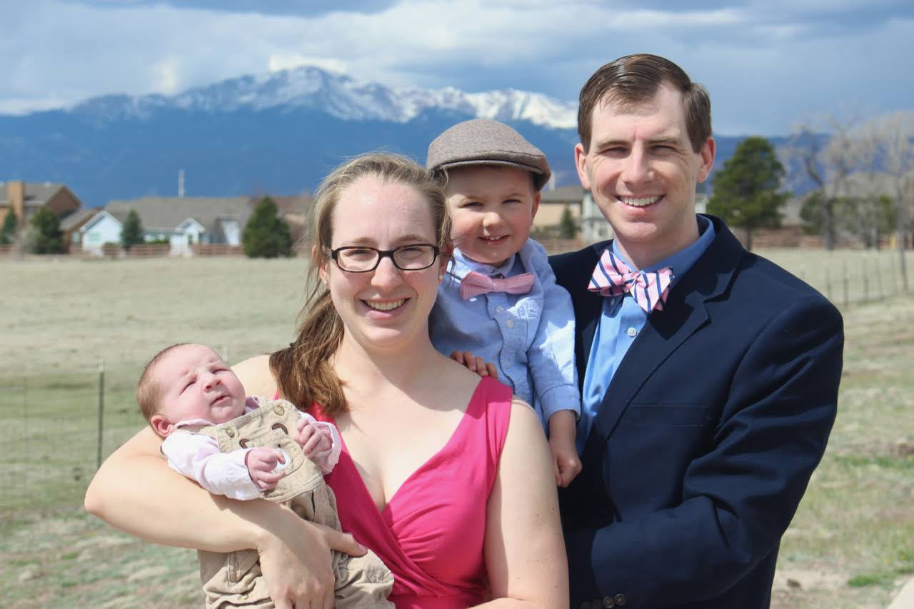 Family portrait with Pikes Peak in the background